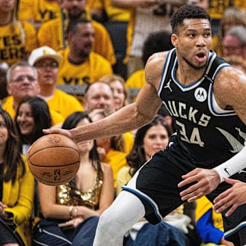 Apr 29, 2025; Indianapolis, Indiana, USA; Milwaukee Bucks forward Giannis Antetokounmpo (34) dribbles  the ball while Indiana Pacers forward Jarace Walker (5)  defends during game five of the first round for the 2024 NBA Playoffs at Gainbridge Fieldhouse. Mandatory Credit: Trevor Ruszkowski-Imagn Images