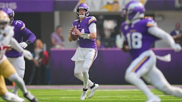 Sep 15, 2024; Minneapolis, Minnesota, USA; Minnesota Vikings quarterback Sam Darnold (14) looks to pass against the San Francisco 49ers in the first quarter at U.S. Bank Stadium. Mandatory Credit: Brad Rempel-Imagn Images