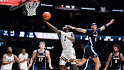 Vanderbilt guard Duke Miles (2) shoots for two points as Virginia guard Jacari White (6) guards him during the second half of their exhibition game at Memorial Gym in Nashville, Tenn., Thursday, Oct. 16, 2025.