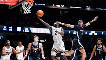 Vanderbilt guard Duke Miles (2) shoots for two points as Virginia guard Jacari White (6) guards him during the second half of their exhibition game at Memorial Gym in Nashville, Tenn., Thursday, Oct. 16, 2025.