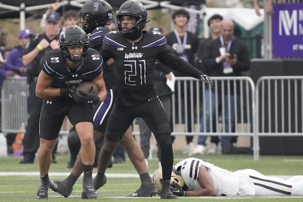     Northwest Wildcats defensive back Robert Fitzgerald (6) reacts after intercepting a pass against the Purdue Boilermakers