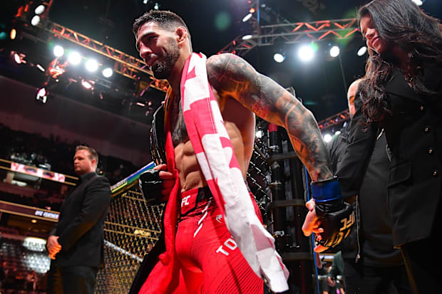 Ilia Topuria celebrates his championship victory against Alexander Volkanovski during UFC 298 at Honda Center.