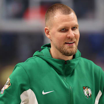 Jun 14, 2024; Dallas, Texas, USA; Boston Celtics center Kristaps Porzingis (8) looks on before game four of the 2024 NBA Finals against the Dallas Mavericks at American Airlines Center. Mandatory Credit: Peter Casey-Imagn Images
