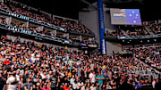 Fans feel the seats of VyStar Veterans Memorial Arena before Anthony Smith fights Jimmy Crute during UFC 261. 