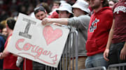 Mar 7, 2024; Pullman, Washington, USA; Washington State Cougars student holds a sign during a basketball game against the Washington Huskies in the first half at Friel Court at Beasley Coliseum. Mandatory Credit: James Snook-Imagn Images