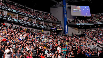 Fans feel the seats of VyStar Veterans Memorial Arena before Anthony Smith fights Jimmy Crute during UFC 261. 