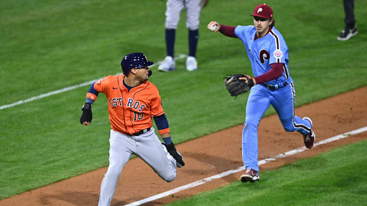 Nov 3, 2022; Philadelphia, Pennsylvania, USA; Houston Astros first baseman Yuli Gurriel (10) is caught in a run-down and tagged out by Philadelphia Phillies first baseman Rhys Hoskins (17) during the seventh inning in game five of the 2022 World Series at Citizens Bank Park.