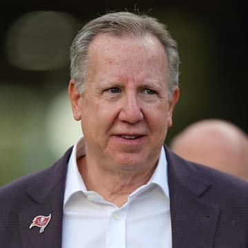Tampa Bay Buccaneers owner and co-chairman Bryan Glazer walks onto the field before a game against the Philadelphia Eagles.