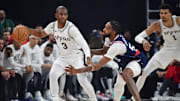 Nov 4, 2024; Inglewood, California, USA;  San Antonio Spurs guard Chris Paul (3) moves the ball against Los Angeles Clippers forward Derrick Jones Jr. (55) during the first half at Intuit Dome. Mandatory Credit: Gary A. Vasquez-Imagn Images