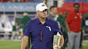 Nov 1, 2024; Boca Raton, Florida, USA;  Florida Atlantic Owls head coach Tom Herman walks on the field before the game against the South Florida Bulls at FAU Stadium. Mandatory Credit: Reinhold Matay-Imagn Images