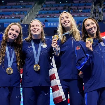 Aug 4, 2024; Nanterre, France; Regan Smith (USA) Lilly King (USA), Gretchen Walsh (USA) and Torri Huske (USA) in the women’s 4 x 100-meter medley relay medal ceremony during the Paris 2024 Olympic Summer Games at Paris La Défense Arena. Mandatory Credit: Rob Schumacher-USA TODAY Sports