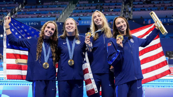 Aug 4, 2024; Nanterre, France; Regan Smith (USA) Lilly King (USA), Gretchen Walsh (USA) and Torri Huske (USA) in the women’s 4 x 100-meter medley relay medal ceremony during the Paris 2024 Olympic Summer Games at Paris La Défense Arena. Mandatory Credit: Rob Schumacher-USA TODAY Sports