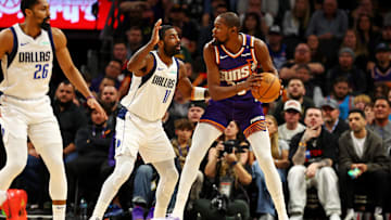 Dec 27, 2024; Phoenix, Arizona, USA; Phoenix Suns forward Kevin Durant (35) handles the ball against Dallas Mavericks guard Kyrie Irving (11) during the third quarter at Footprint Center. Mandatory Credit: Mark J. Rebilas-Imagn Images