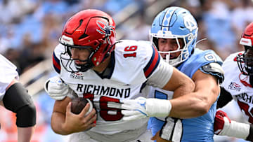 Sep 13, 2025; Chapel Hill, North Carolina, USA; North Carolina Tar Heels defensive lineman Melkart Abou-Jaoude (9) sacks Richmond Spiders quarterback Kyle Wickersham (16) in the first quarter at Kenan Stadium. Mandatory Credit: Bob Donnan-Imagn Images