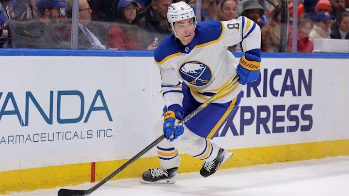 Jan 24, 2026; Elmont, New York, USA; Buffalo Sabres defenseman Michael Kesselring (8) skates with the puck against the New York Islanders during the second period at UBS Arena. Mandatory Credit: Brad Penner-Imagn Images