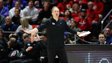 Kevin Young calls out to his team as they fall to rival Utah.
