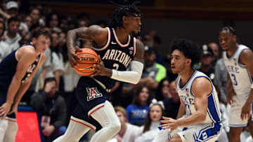 Nov 10, 2023; Durham, North Carolina, USA;  Arizona Wildcats guard Caleb Love (2) drives to the basket as Duke Blue Devils guard Jared McCain (0) defends during the second half at Cameron Indoor Stadium. Mandatory Credit: Rob Kinnan-Imagn Images
