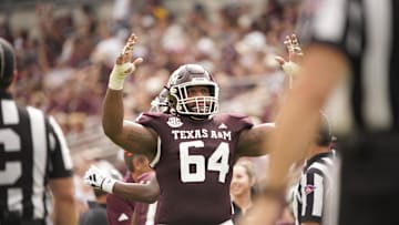 Oct 28, 2023; College Station, Texas, USA; Texas A&M Aggies offensive lineman Layden Robinson (64) celebrates a team touchdown during the second half in a game against South Carolina Gamecocks at Kyle Field. Mandatory Credit: Dustin Safranek-Imagn Images