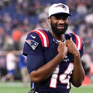 Aug 15, 2024; Foxborough, Massachusetts, USA; New England Patriots quarterback Jacoby Brissett (14) walks onto the field during a timeout against the Philadelphia Eagles in the second half at Gillette Stadium.