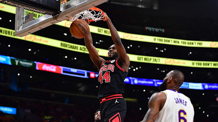 Mar 26, 2023; Los Angeles, California, USA; Chicago Bulls forward Patrick Williams (44) dunks for the basket in front of Los Angeles Lakers forward LeBron James (6) during the second half at Crypto.com Arena. Mandatory Credit: Gary A. Vasquez-Imagn Images