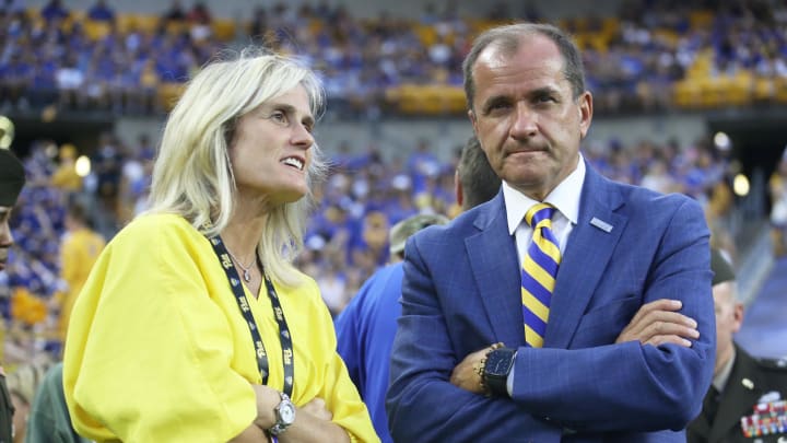 Sep 9, 2023; Pittsburgh, Pennsylvania, USA; University of Pittsburgh Athletics Director Heather Lyke (left) and ACC Commissioner James J. Phillips (right) talk on the field during the first quarter as the Panthers host the Cincinnati Bearcats at Acrisure Stadium. Mandatory Credit: Charles LeClaire-USA TODAY Sports