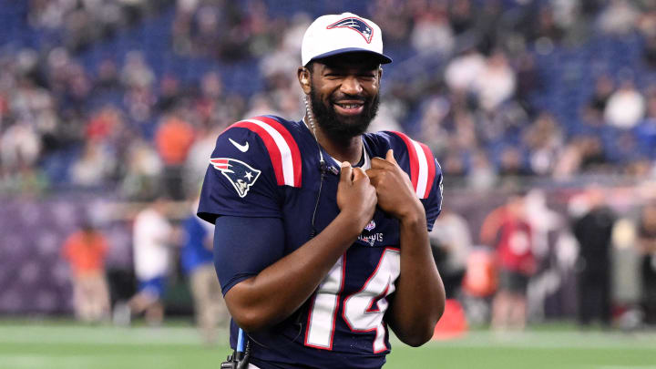 Aug 15, 2024; Foxborough, Massachusetts, USA; New England Patriots quarterback Jacoby Brissett (14) walks onto the field during a timeout against the Philadelphia Eagles in the second half at Gillette Stadium. Mandatory Credit: Brian Fluharty-USA TODAY Sports