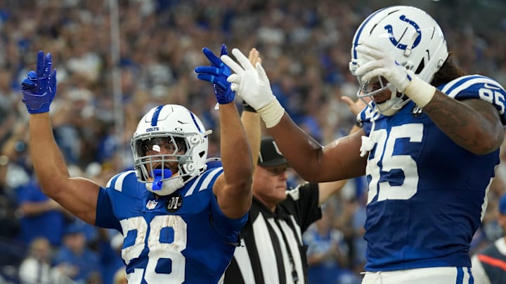 Indianapolis Colts running back Jonathan Taylor (28) and tight end Andrew Ogletree (85) react after Taylor scores a touchdown against the Las Vegas Raiders on Sunday, Oct. 5, 2025, during a game at Lucas Oil Stadium in Indianapolis. The Colts defeated the Raiders 40-6.