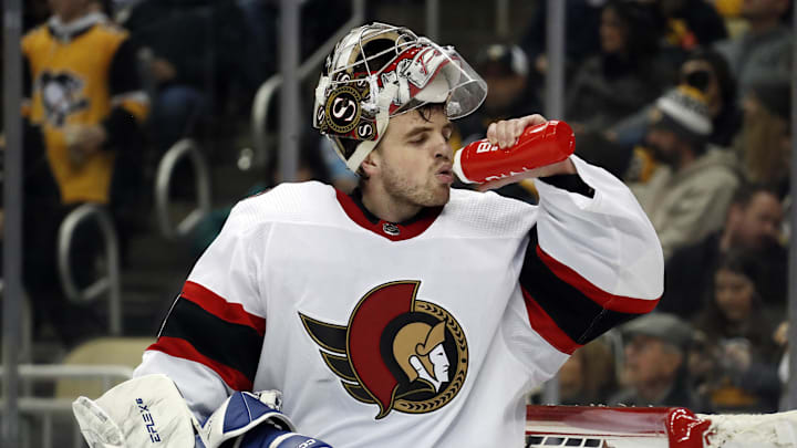 Mar 20, 2023; Pittsburgh, Pennsylvania, USA;  Ottawa Senators goaltender Dylan Ferguson (34) takes a drink during a time-out against the Pittsburgh Penguins  in the third period at PPG Paints Arena. Ottawa won 2-1. Mandatory Credit: Charles LeClaire-Imagn Images