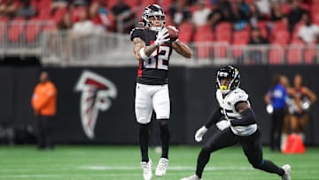 Aug 23, 2024; Atlanta, Georgia, USA; Atlanta Falcons wide receiver Casey Washington (82) catches a pass in front of Jacksonville Jaguars cornerback Ronald Darby (25) in the first quarter at Mercedes-Benz Stadium.