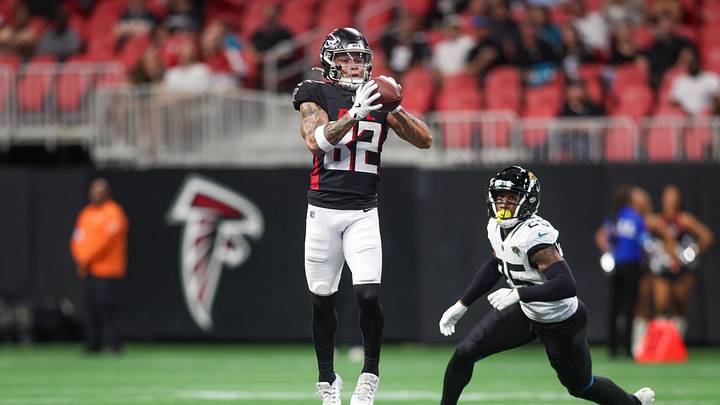 Aug 23, 2024; Atlanta, Georgia, USA; Atlanta Falcons wide receiver Casey Washington (82) catches a pass in front of Jacksonville Jaguars cornerback Ronald Darby (25) in the first quarter at Mercedes-Benz Stadium.