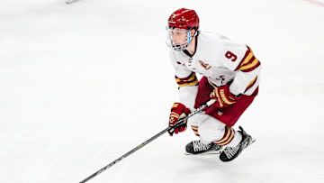 Apr 11, 2024; Saint Paul, Minnesota, USA; Boston College Eagles forward Ryan Leonard (9) carries the puck in the semifinals of the 2024 Frozen Four college ice hockey tournament during the third period against the Michigan Wolverines at Xcel Energy Center. Mandatory Credit: Brace Hemmelgarn-Imagn Images