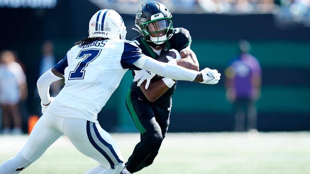 New York Jets wide receiver Garrett Wilson (5) prepares to be tackled by Dallas Cowboys cornerback Trevon Diggs (7), Sunday, October 5, 2025. New York Jets wide receiver Garrett Wilson (5) prepares to be tackled by Dallas Cowboys cornerback Trevon Diggs (7), Sunday, October 5, 2025.
