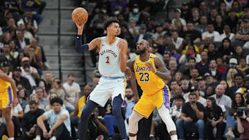 Nov 27, 2024; San Antonio, Texas, USA;  San Antonio Spurs center Victor Wembanyama (1) handles the ball in front of Los Angeles Lakers forward LeBron James (23) in the second half at Frost Bank Center. Mandatory Credit: Daniel Dunn-Imagn Images