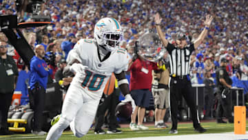 Miami Dolphins wide receiver Tyreek Hill (10) scores a touchdown against the Buffalo Bills in the fourth quarter at Highmark Stadium. 