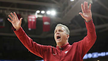 Oct 25, 2024; Fayetteville, AR, USA; Arkansas Razorbacks head coach John Calipari quiets the crowd as they began chanting “overrated” late in the second half against the Kansas Jayhawks at Bud Walton Arena. Mandatory Credit: Nelson Chenault-Imagn Images