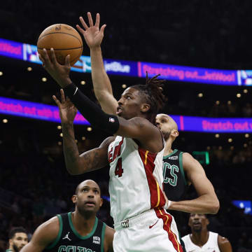 May 1, 2024; Boston, Massachusetts, USA; Miami Heat guard Delon Wright (4) goes to the basket past Boston Celtics guard Derrick White (9) during the first quarter of game five of the first round of the 2024 NBA playoffs at TD Garden. Mandatory Credit: Winslow Townson-USA TODAY Sports
