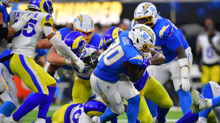 Aug 17, 2024; Inglewood, California, USA; Los Angeles Chargers running back Kimani Vidal (30) runs the ball against the Los Angeles Rams during the second half at SoFi Stadium. Mandatory Credit: Gary A. Vasquez-USA TODAY Sports