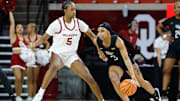 UCF Knights guard Kaitlin Peterson (3) moves around Oklahoma Sooners forward Kiersten Johnson (5) during the second half of an NCAA Women's Basketball game at Lloyd Noble Center in Norman, Okla., Saturday, Dec. 30, 2023. Oklahoma won 69-52.