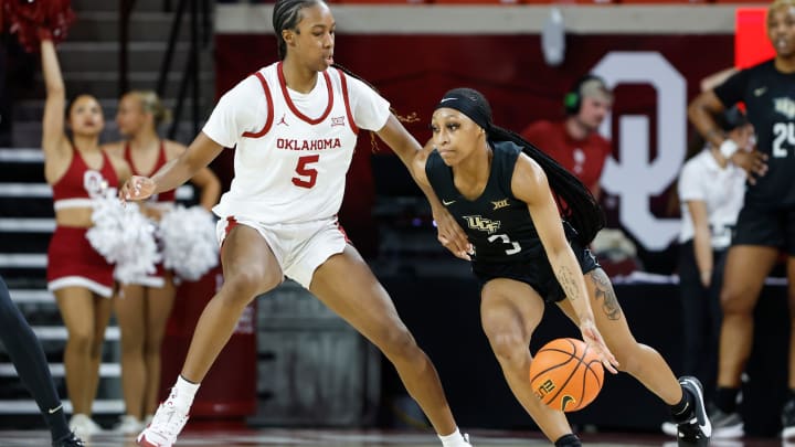 UCF Knights guard Kaitlin Peterson (3) moves around Oklahoma Sooners forward Kiersten Johnson (5) during the second half of an NCAA Women's Basketball game at Lloyd Noble Center in Norman, Okla., Saturday, Dec. 30, 2023. Oklahoma won 69-52.