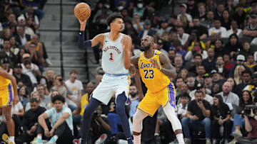 Nov 27, 2024; San Antonio, Texas, USA;  San Antonio Spurs center Victor Wembanyama (1) handles the ball in front of Los Angeles Lakers forward LeBron James (23) in the second half at Frost Bank Center. Mandatory Credit: Daniel Dunn-Imagn Images