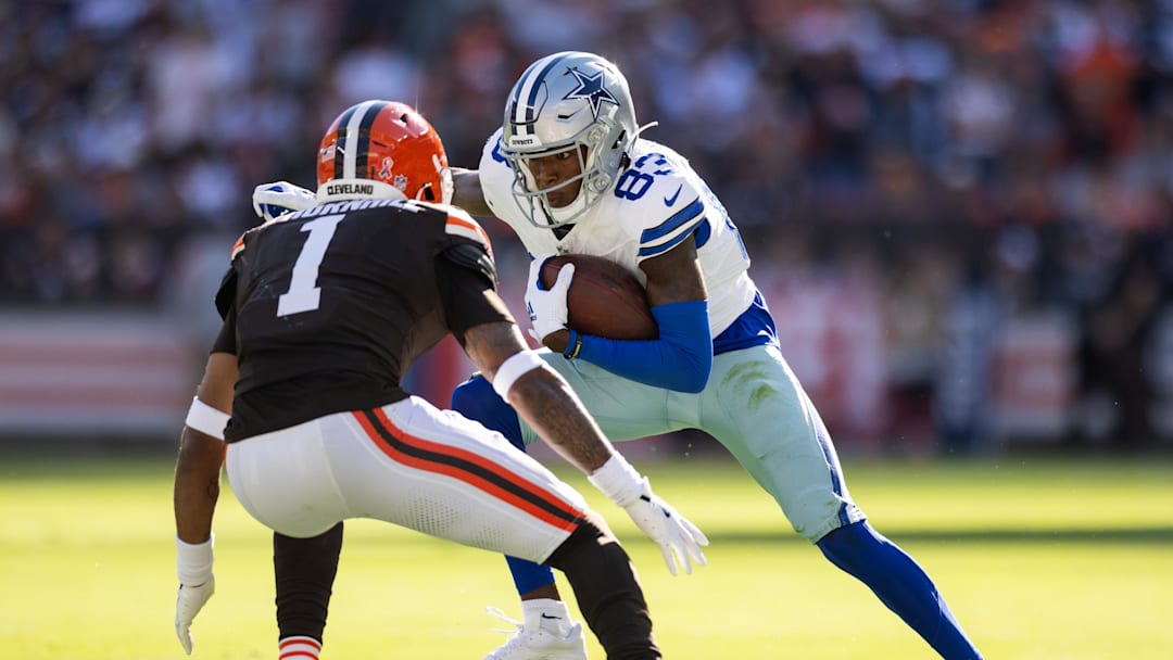 Sep 8, 2024; Cleveland, Ohio, USA; Dallas Cowboys wide receiver Jalen Brooks (83) runs the ball against Cleveland Browns safety Juan Thornhill (1) during the second quarter at Huntington Bank Field. Mandatory Credit: Scott Galvin-Imagn Images