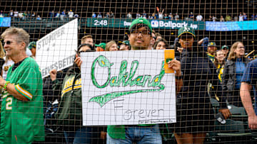 Sep 29, 2024; Seattle, Washington, USA; An Oakland Athletics fan holds a sign after the game between the Seattle Mariners and the Oakland Athletics at T-Mobile Park.