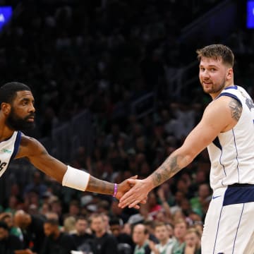 Jun 9, 2024; Boston, Massachusetts, USA; Dallas Mavericks guard Kyrie Irving (11) high fives guard Luka Doncic (77) after a play against the Boston Celtics during the first quarter in game two of the 2024 NBA Finals at TD Garden. Mandatory Credit: Peter Casey-USA TODAY Sports