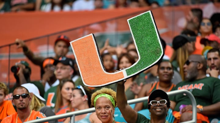 Sep 8, 2018; Miami Gardens, FL, USA; A Miami Hurricanes fan holds a school logo sign during the first half against the Savannah State Tigers at Hard Rock Stadium. Mandatory Credit: Jasen Vinlove-USA TODAY Sports