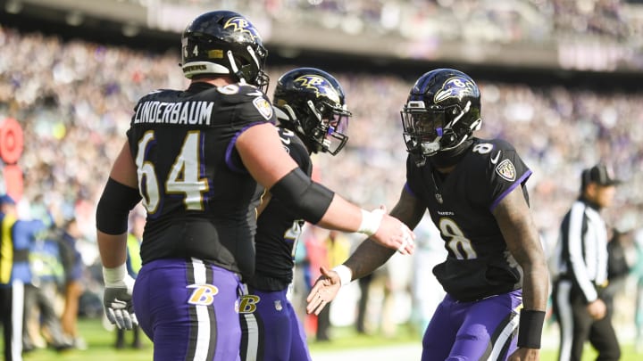 Baltimore Ravens quarterback Lamar Jackson (8) celebrates with center Tyler Linderbaum (64) after a touchdown during the first half against the Miami Dolphins at M&T Bank Stadium. 