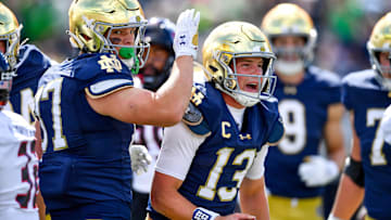 Sep 7, 2024; South Bend, Indiana, USA; Notre Dame Fighting Irish quarterback Riley Leonard (13) celebrates after scoring a touchdown.