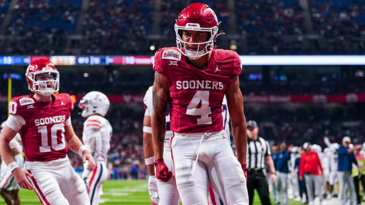 Dec 28, 2023; San Antonio, TX, USA;  Oklahoma Sooners wide receiver Nic Anderson (4) celebrates a touchdown catch in the first half against the Arizona Wildcats at Alamodome. Mandatory Credit: Daniel Dunn-USA TODAY Sports