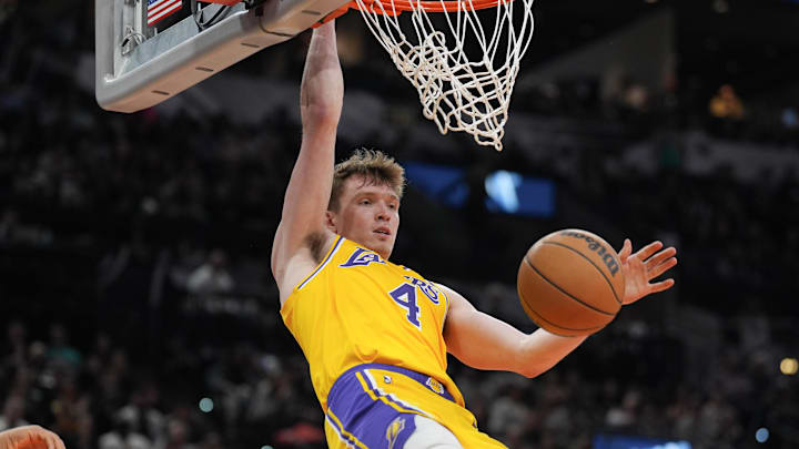 Nov 27, 2024; San Antonio, Texas, USA; Los Angeles Lakers guard Dalton Knecht (4) dunks in the second half against the San Antonio Spurs at Frost Bank Center. Mandatory Credit: Daniel Dunn-Imagn Images