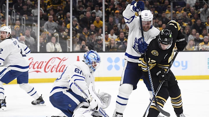 Apr 30, 2024; Boston, Massachusetts, USA; Toronto Maple Leafs defenseman Jake McCabe (22) and Boston Bruins center Charlie Coyle (13) battle in front of goaltender Joseph Woll (60) during the third period in game five of the first round of the 2024 Stanley Cup Playoffs at TD Garden. Mandatory Credit: Bob DeChiara-Imagn Images