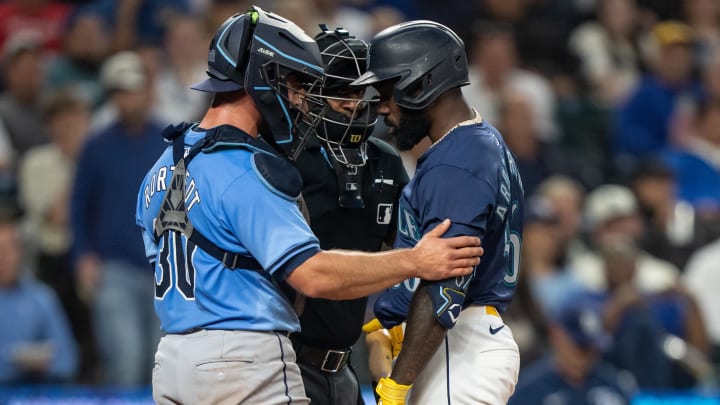 Tampa Bay Rays catcher Ben Rortvedt (30) checks on Seattle Mariners left fielder Randy Arozarena (56) after Arozarena was hit by a pitch during the fifth inning at T-Mobile Park on Aug 26.